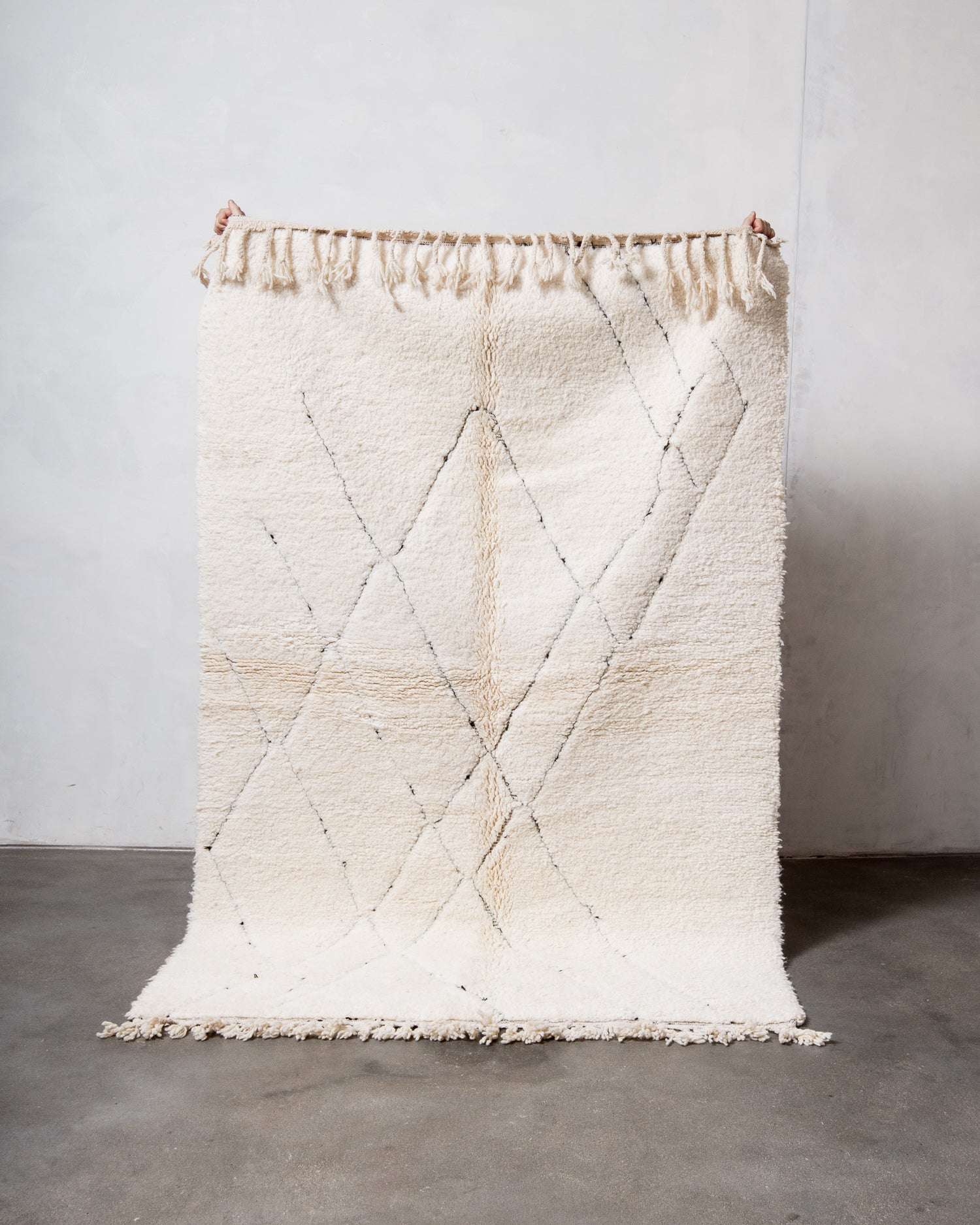 Modern, designer, handcrafted Berber rug from Morocco. Beniourain carpet with minimalist design, natural wool pile and a fluffy texture.